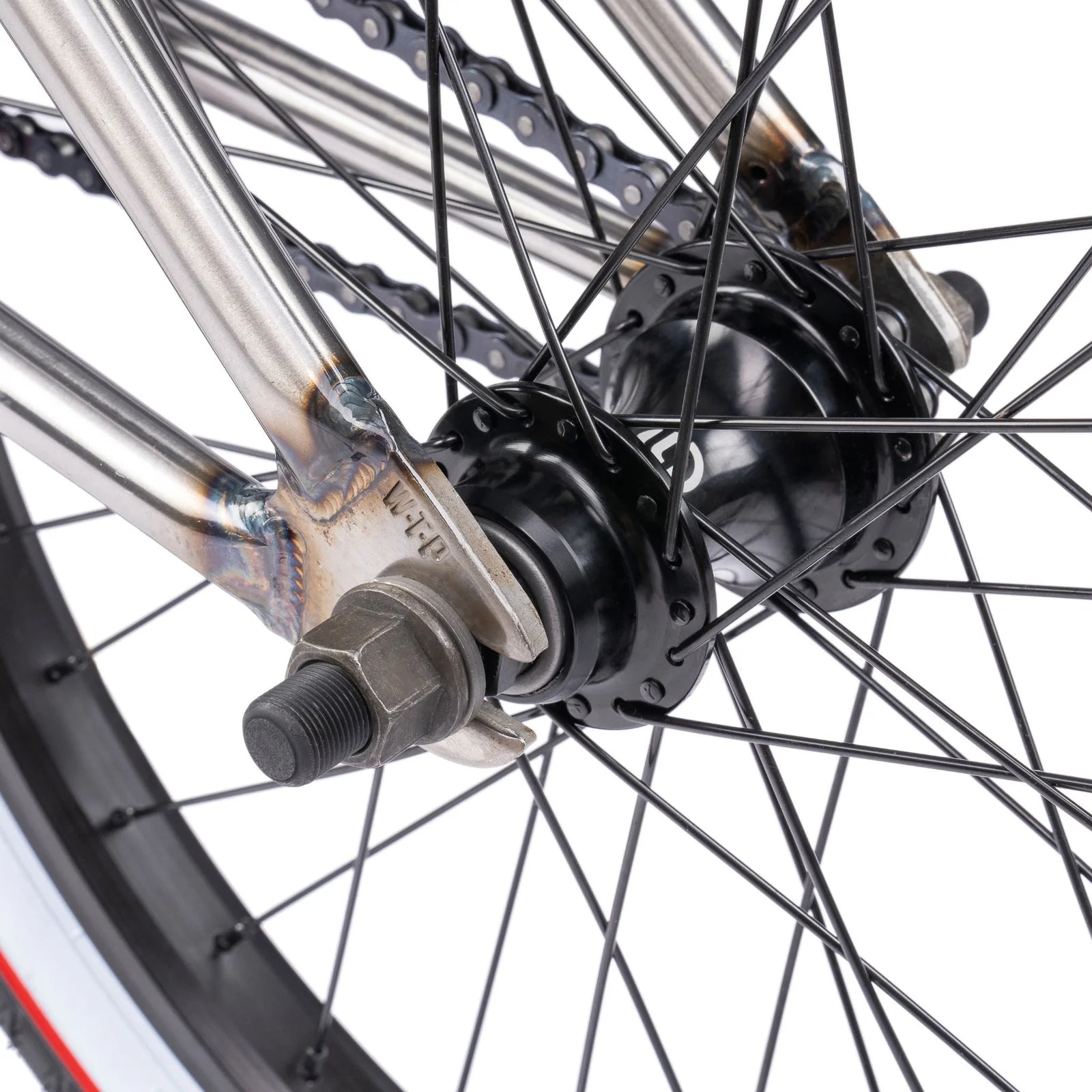 Close-up of a bicycle wheel hub with chain and spokes on a white background